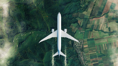 白色飞机飞越欧洲绿野