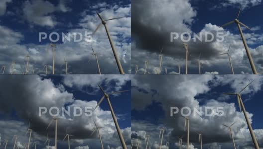 多云天空背景下的风力涡轮机发电机高清在线视频素材下载