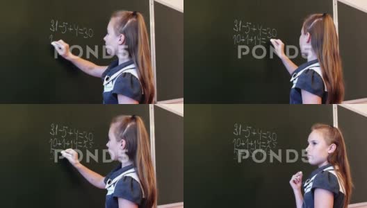 在黑板上计算的女孩特写高清在线视频素材下载