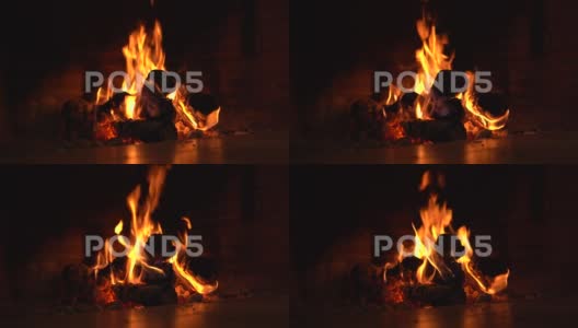炉中火焰的透视镜头，用于烹饪和取暖的炉渣高清在线视频素材下载