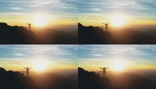 站在山上看日出的人的4k高清航拍镜头高清在线视频素材下载