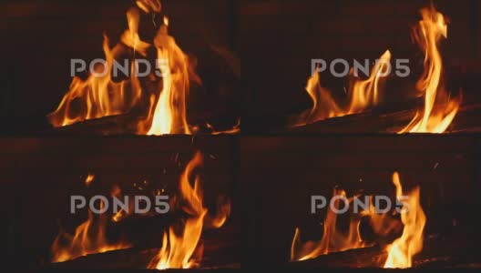 夜间手持镜头中火盆中燃烧的木材高清在线视频素材下载