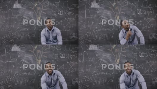 4K肖像：一个坐在黑板前思考的男人，身后有数学公式高清在线视频素材下载