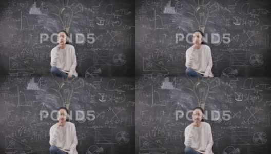 4K坐在黑板前思考数学公式的女人的肖像高清在线视频素材下载