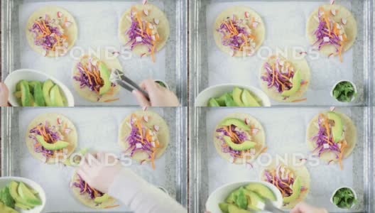 在白玉米饼上准备新鲜的鳕鱼和紫甘蓝玉米卷高清在线视频素材下载