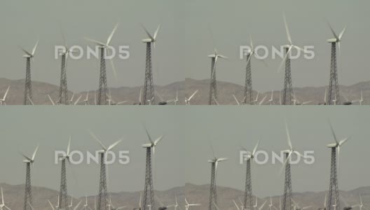 风力涡轮机在山峦环绕的背景下高清在线视频素材下载