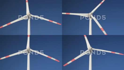 蓝天上旋转风力涡轮机的特写镜头。高清在线视频素材下载