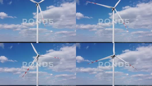 蓝天上风力涡轮机的鸟瞰图高清在线视频素材下载