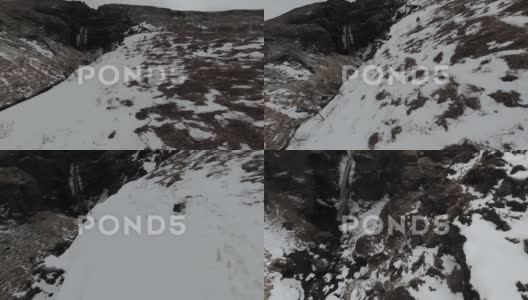 小瀑布和溪流上的雪的风景高清在线视频素材下载
