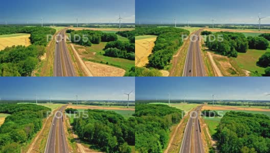 高速公路附近金色田野和风力涡轮机的鸟瞰图。高清在线视频素材下载