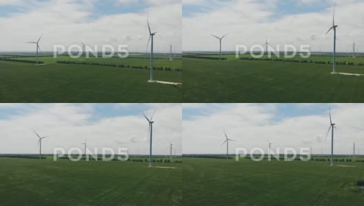 带有蓝天和草地的风力涡轮机高清在线视频素材下载