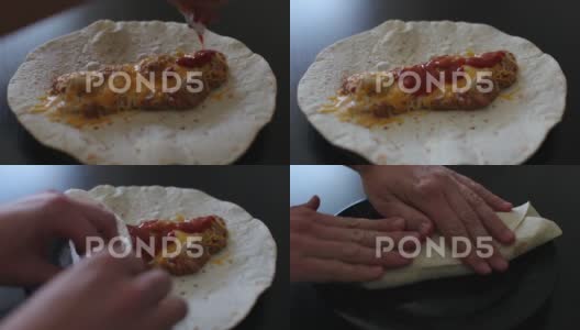 把辣酱淋在玉米卷饼上高清在线视频素材下载