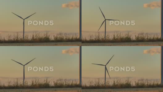 风力涡轮机旋转的景观图高清在线视频素材下载