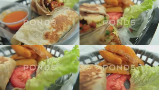 塑料篮子里的辣猪肉卷饼和莴苣高清在线视频素材下载